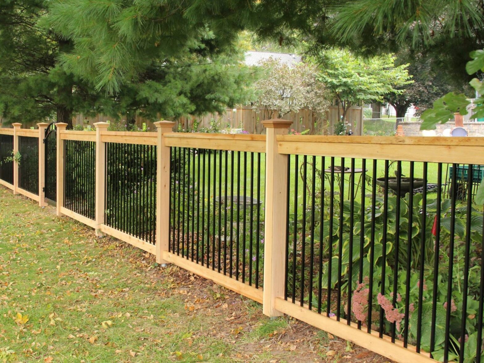 Decorative aluminum fence surrounding a front yard