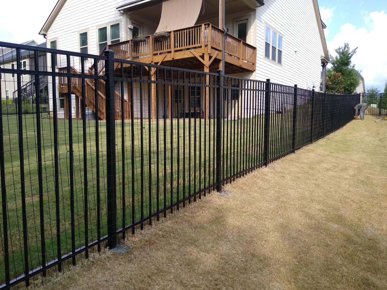 Ornamental steel fence surrounding an office park