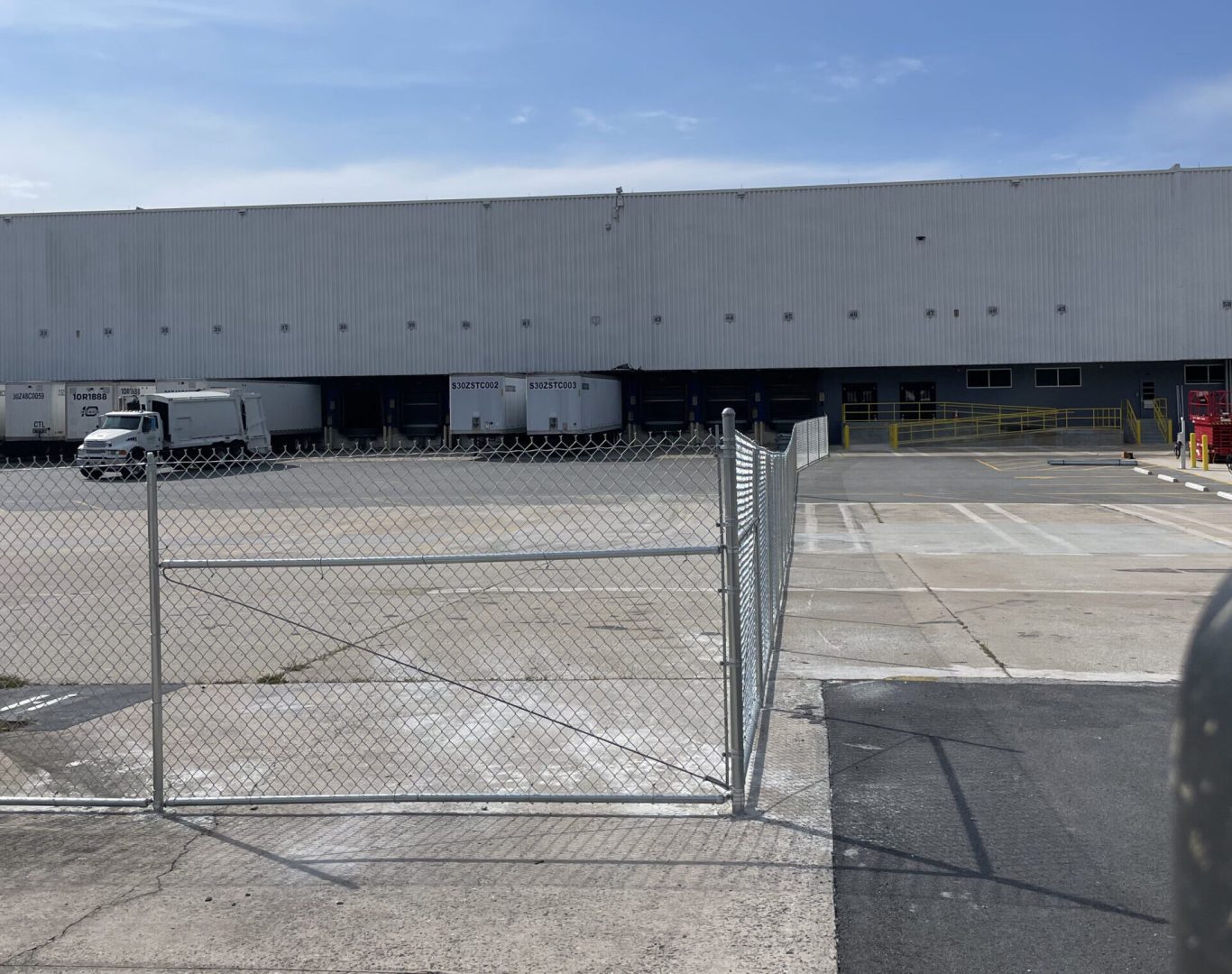 Commercial chain link fence installation at a Raleigh business property