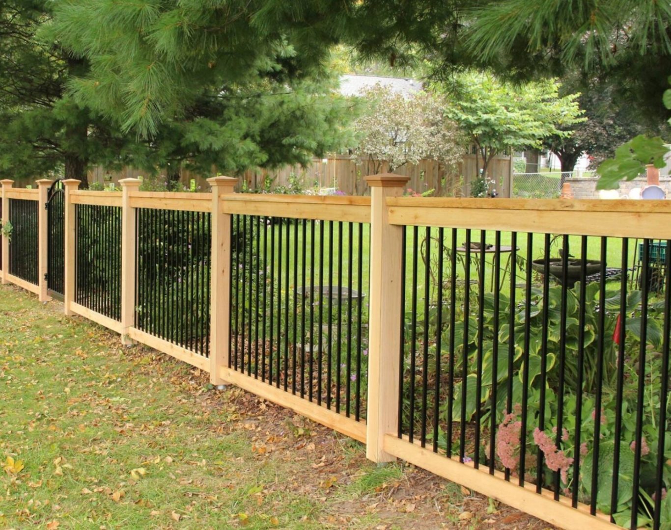 Decorative aluminum fence surrounding a front yard